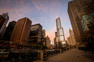 Early morning view of the riverwalk next to the main stem of the Chicago River with skyscrapers in the background, Downtown Chicago, IL, USA