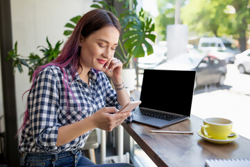 Woman typing on notebook with blank screen with copy space for your text or advertising content,...