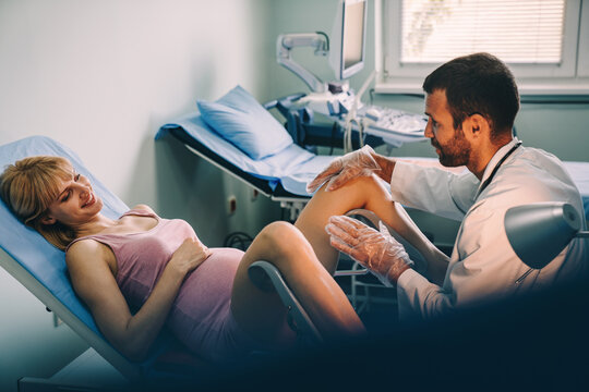 Young male gynecologist during examination in hosptial.