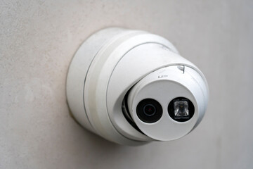 CCTV Camera security system mounted on wall. Video surveillance camera on wall, monitoring entrance...