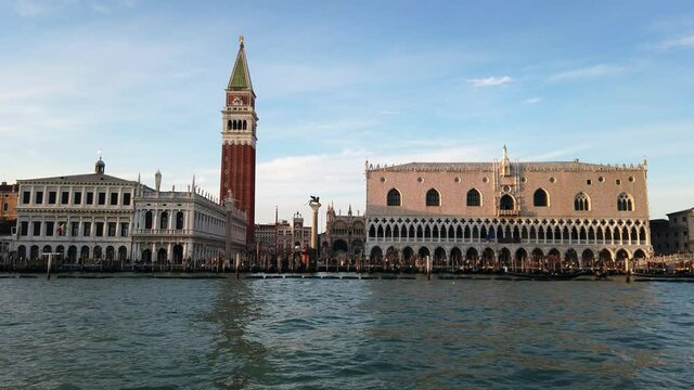 Europe, Venice November 2021  Europe, Italy , Venice - Piazza San Marco and Ducal Palace ( doges palace )  with Clock tower and lion  view from the boat gondola in Venetian lagoon 