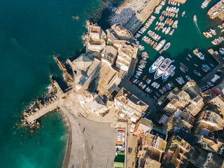 Ancient Italian old town and port next to mediterranean sea beach. Camogli, Italy. Liguria coast. Aerial view. 