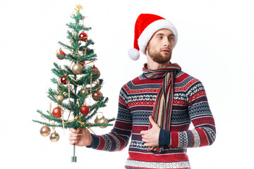 handsome man in a santa hat Christmas decorations holiday New Year isolated background