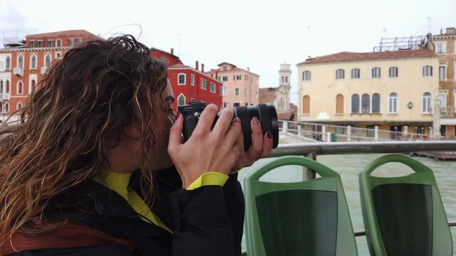 Europe, Venice - young girl taking pictures in Venezia from the boat  - tourism resumes with the end of the lockdown Covid-19 Coronavirus in Italy - Murano