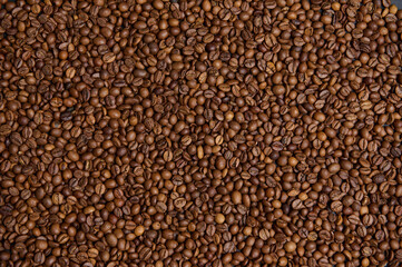 Flat lay composition of fresh roasted coffee beans. Coffee grains background. Food background. Copy space