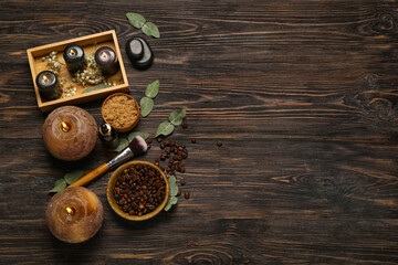 Beautiful spa composition with burning candles and coffee beans on wooden background
