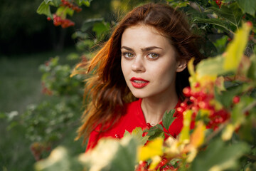 beautiful woman bush with berries nature fresh air