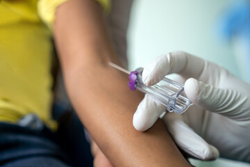 Fototapeta na wymiar Pediatrician takes blood from a child patient. Healthcare antibody test coronavirus concept