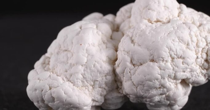 Magnesite. It is used in industry, lithotherapy, jewelry. Close-up of the structure of the stone.