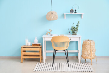 Stylish workplace with alarm clock in interior of room