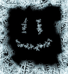 Frame with a frosty pattern of ice crystals on a black background. Frame with a frosty smile allows...