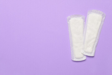 Menstrual pads on purple background