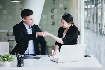 Business Success concept with partner, Partnership Giving Fist Bump after Complete a deal. Successful Teamwork, Businessman with Team Agreement in Corporate.