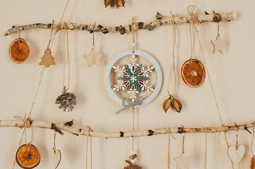 Handmade craft Christmas tree from sticks and natural materials.