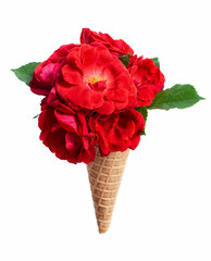 Ice cream waffle cone with a bouquet of summer red flowers red roses over white background. Diet and thinking outside the box design concept