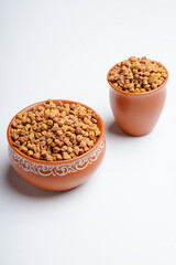 Dry chickpea in bowl on white background.