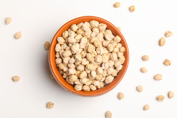 Dry chickpea in bowl on white background.