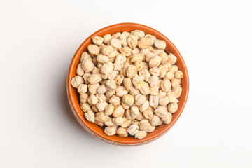 Dry chickpea in bowl on white background.