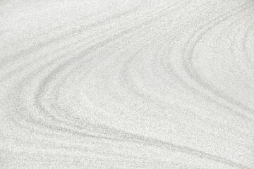 Fototapeta na wymiar Wellenförmige Sandstruktur bei Ebbe am Nordseestrand