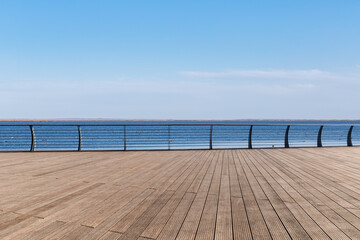 Fototapeta na wymiar lake view and wooden floor with railing