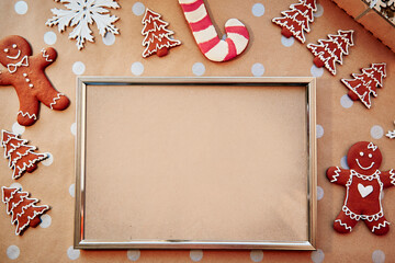 Christmas homemade gingerbread cookies with mock up frame. Homemade baking cookies. Festive aesthetic card. Christmas atmosphere. Merry Christmas and home coziness concept