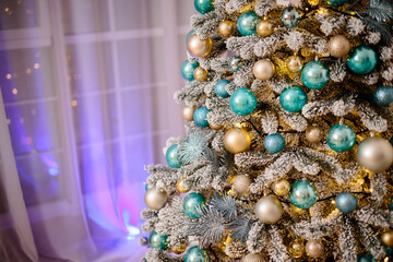 Christmas decorations on the tree, beautiful toys in light colors. Christmas atmosphere, new year