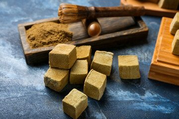 Tasty hojicha marshmallows on color background, closeup