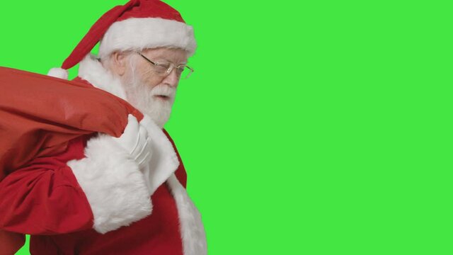Portrait Shot of Santa Carrying Sack with Green Screen