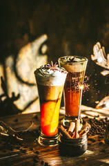 Pumpkin latte. Festive atmosphere. Front in focus.