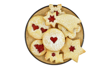 Various shapes of Linzer cookies filled with strawberry jam on a plate, isolated on white background