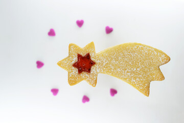 Linzer cookie in a shape of comet filled with strawberry jam © Martina