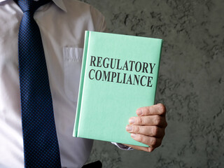 A man propose book about regulatory compliance.