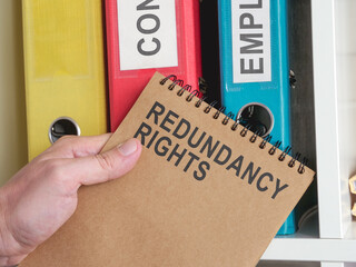 An employee holds info about redundancy rights.