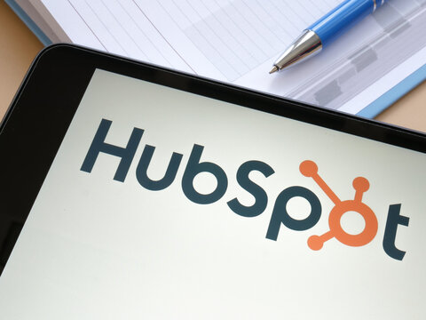 KYIV, UKRAINE - October 21, 2021. Tablet With HubSpot Company Logo And Notebook.