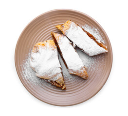 Plate with pieces of delicious pumpkin strudel on white background