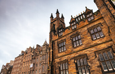 Fototapeta na wymiar New College building, The University of Edinburgh in Scotland during an autumn cloudy morning. Landmarks of United Kingdom. Education.