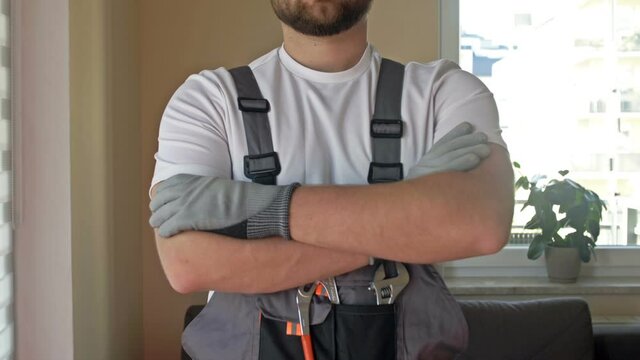 Employee of the company for the provision of personal services is ready to work. Master show with a gesture that everything will be fine.