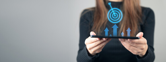woman holding tablet with target