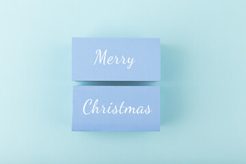Merry Christmas minimal modern concept in light pastel blue colors