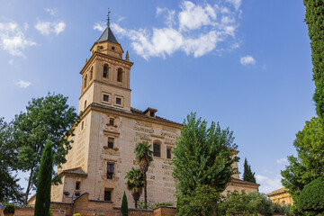 Fototapeta na wymiar Looking up at the Santa Maria de la Alhambra church next to the palace of Charles V