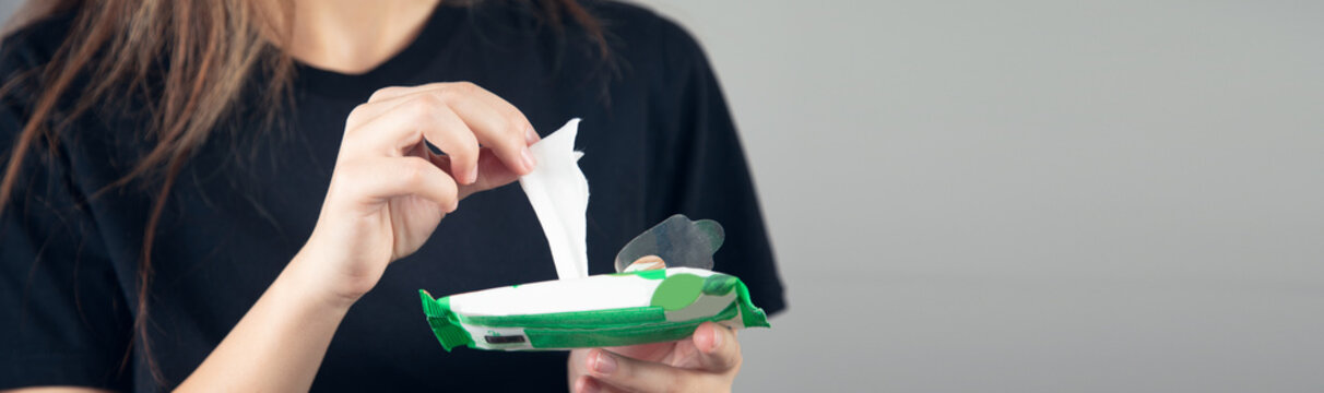 Woman Holding Wet Wipes From Package