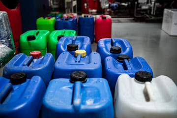 Barrels with chemicals in a chemical warehouse, colored containers, waste management