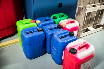 Barrels with chemicals in a chemical warehouse, colored containers, waste management