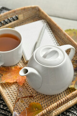 Tray with tea pot on sofa