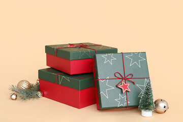 Christmas gift boxes and decor on beige background