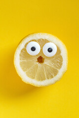 funny lemon on the yellow background