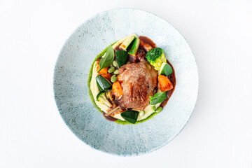 Goose Legs with vegetables isolated