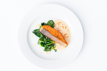 salmon steak with spinach and caviar