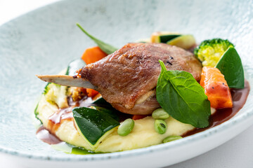 Goose Legs with vegetables isolated