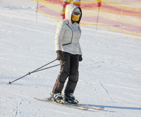 A man is skiing in the snow